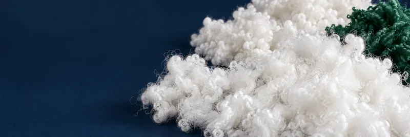 Illustrative composition of white polyester staple fibers, pearl fiber and green recycled fiber