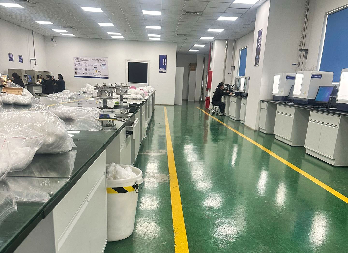 Staff and equipment in the fiber inspection room